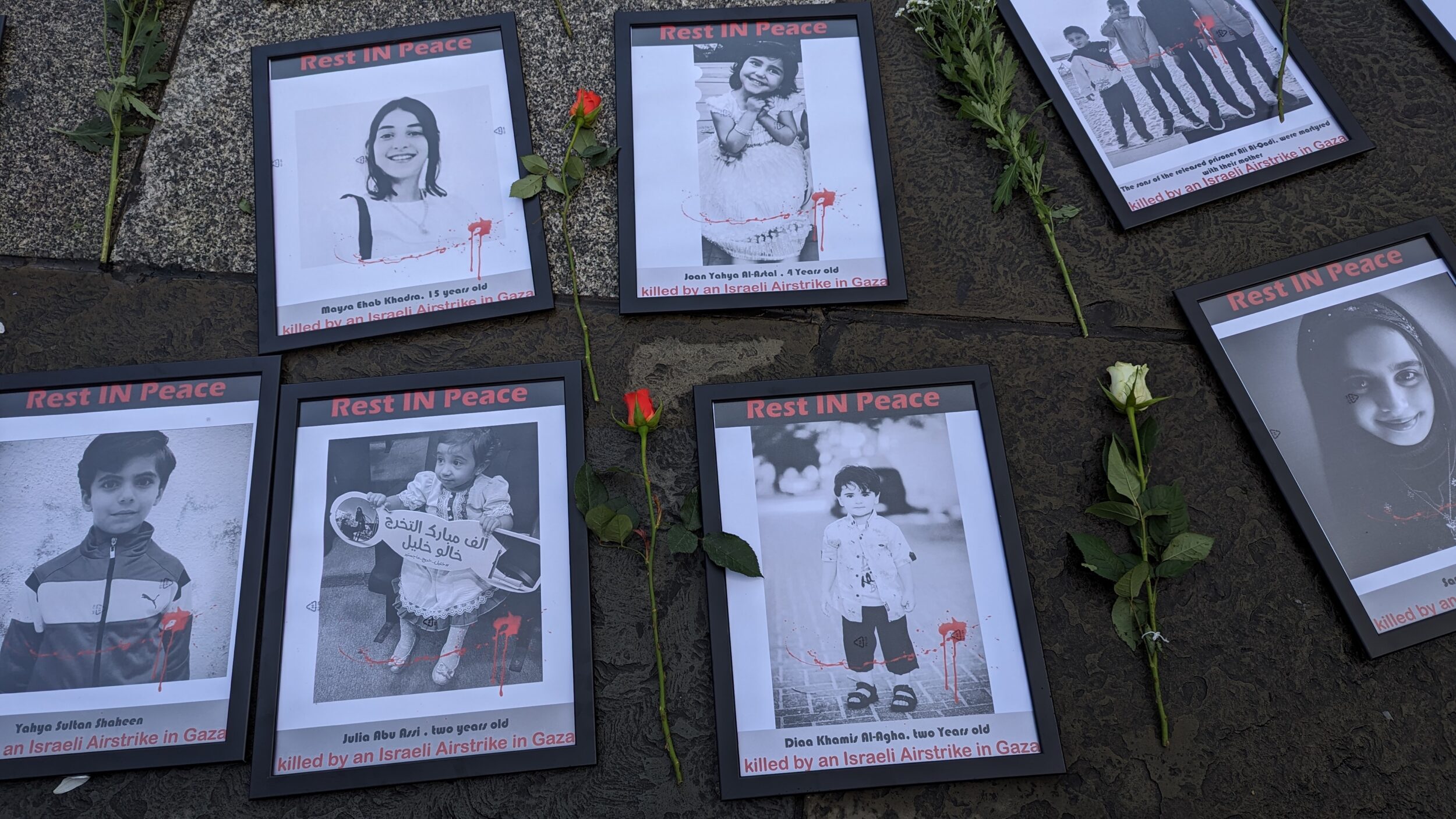Pictures of children in frames with roses by their side