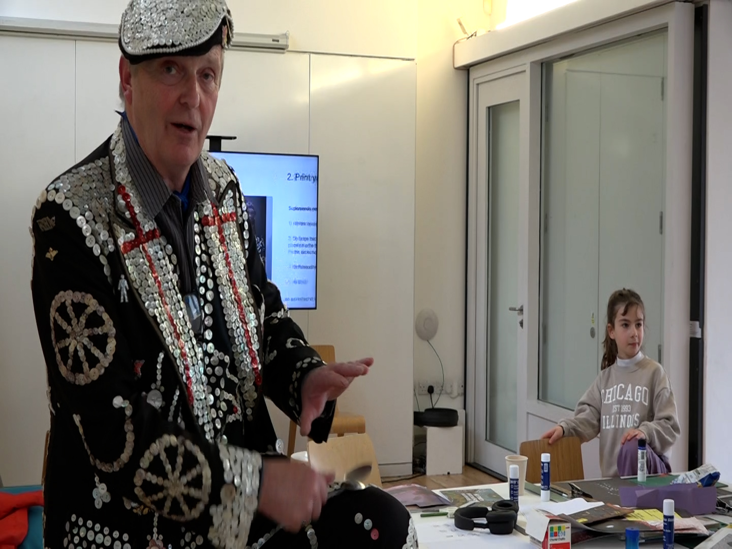 The Pearly King Clive Bennett performs in the workshop