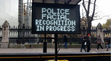 A sign warning people of 'police facial recognition in progress'