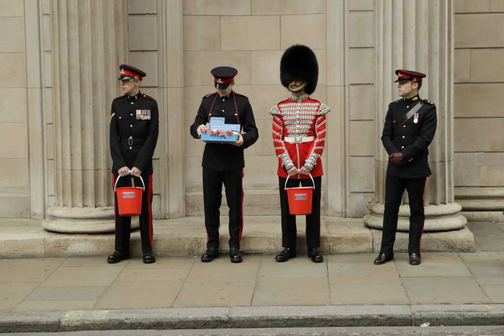 Members of the British military's Honourable Artillery Company collecting donations outside the Bank of England in the City of London.