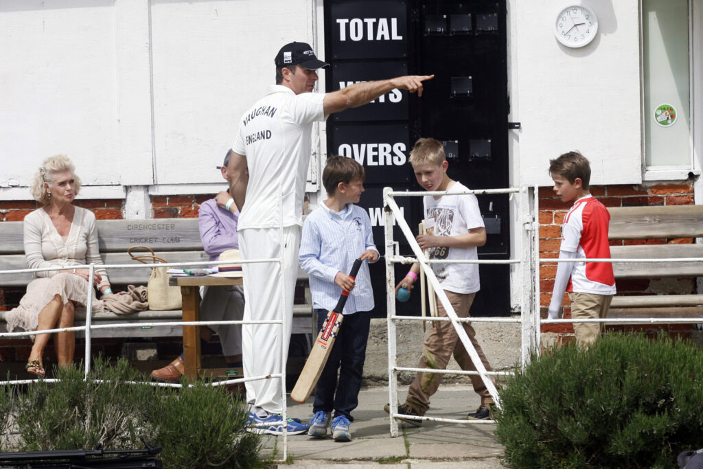 England Cricketer Michael Vaughan points to where young children can play as he attends the "Cricket for Kids" charity match between England and Australia.