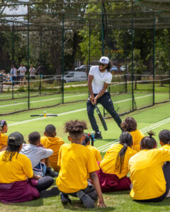 Coach demoing with kids