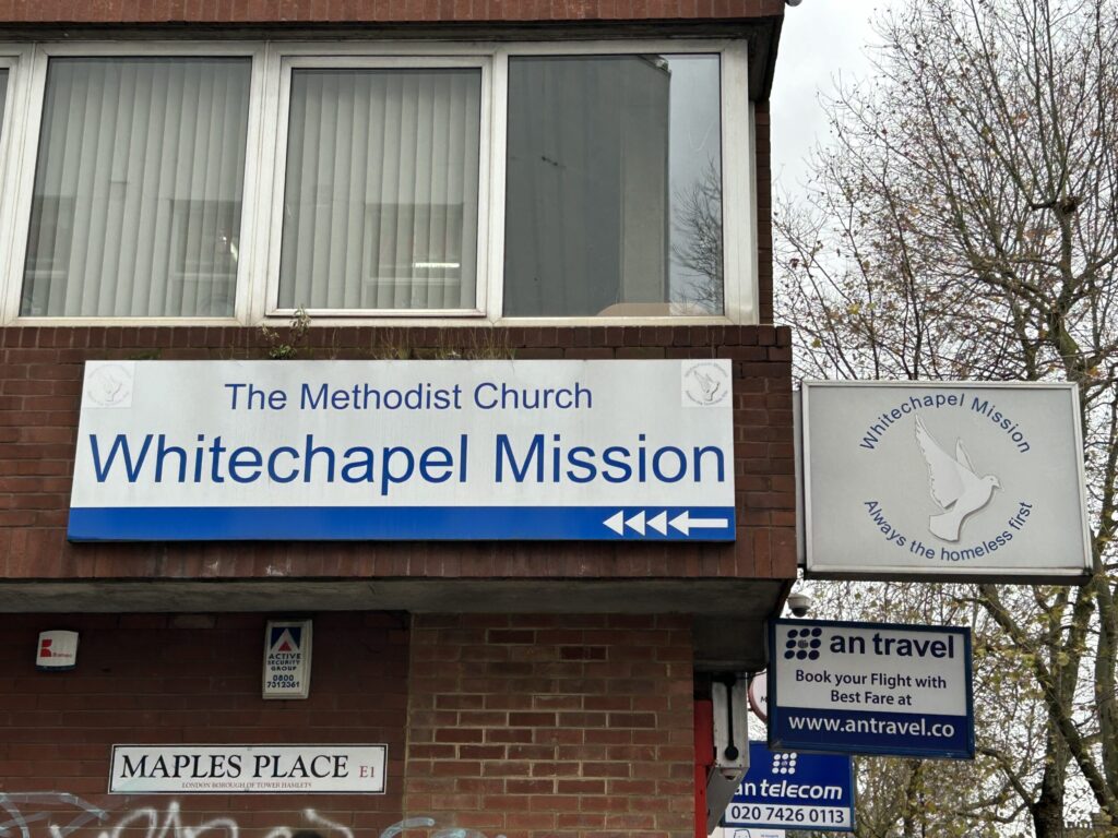 Homelessness charity street sign that says “The Methodist Church Whitechapel Mission”