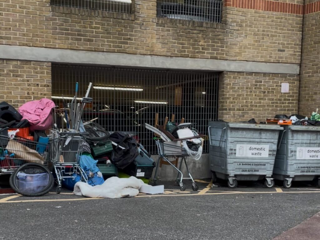 Bins marked with 'Barking and Dagenham Council' next to piles of rubbish in Barking. 