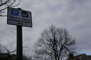 A sign at an electric car recharging port on a street in London. 