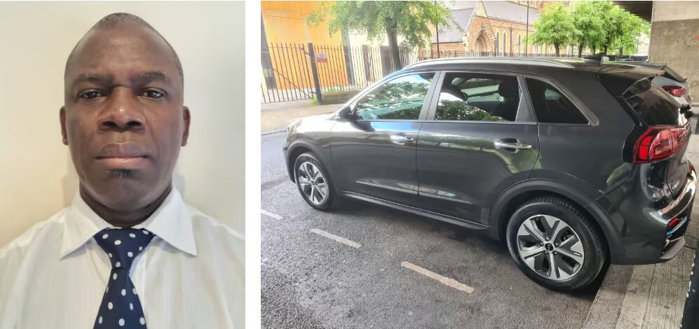 A London electric minicab driver wearing a white shirt and navy tie, looking directly at the camera.
