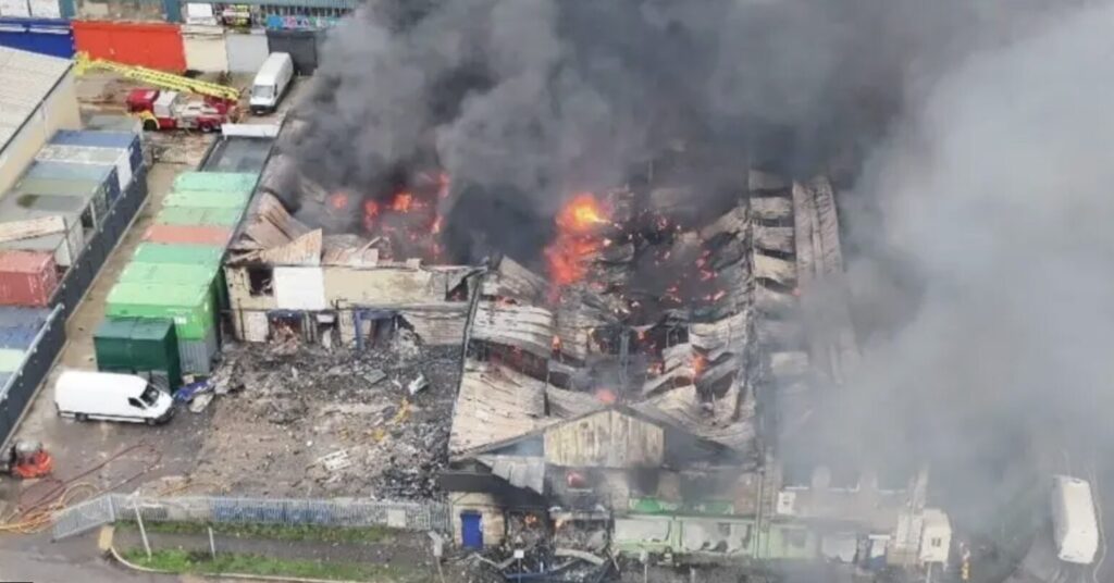 Fire continues to burn at warehouse in West London.