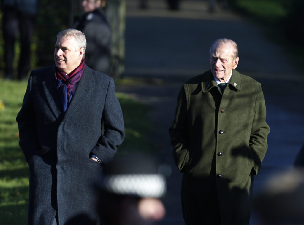 Andrew Mountbatten-Windsor (left) with his father the late Prince Philip on the Sandringham Estate in 2011.